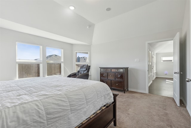 bedroom with carpet and high vaulted ceiling