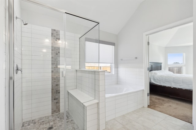 bathroom with plus walk in shower, tile patterned floors, and vaulted ceiling