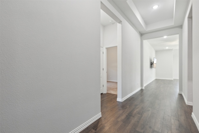 hall with dark wood-type flooring