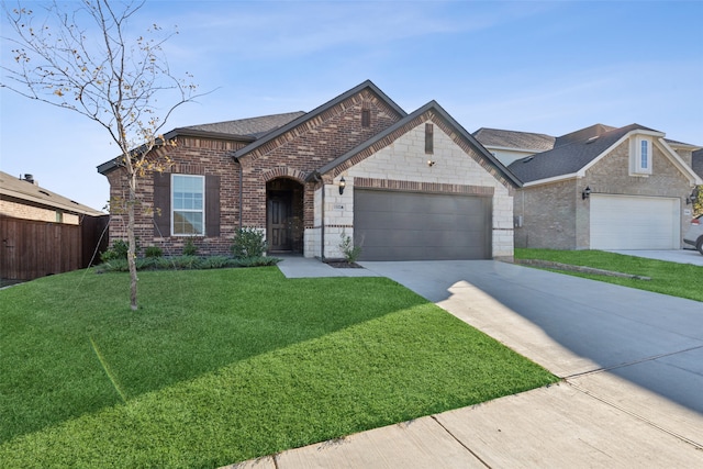 ranch-style house with a garage and a front lawn