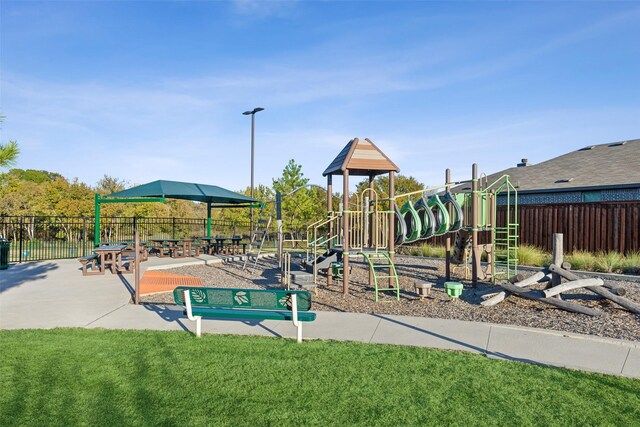 view of playground featuring a lawn