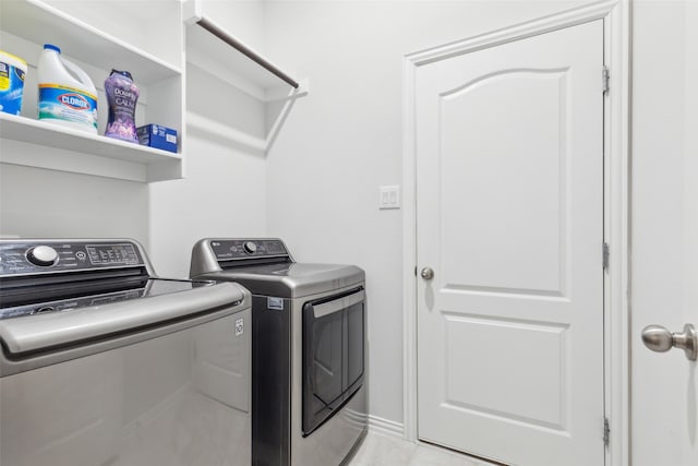 washroom with washer and clothes dryer