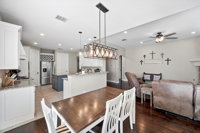 dining room featuring ceiling fan and wood-type flooring