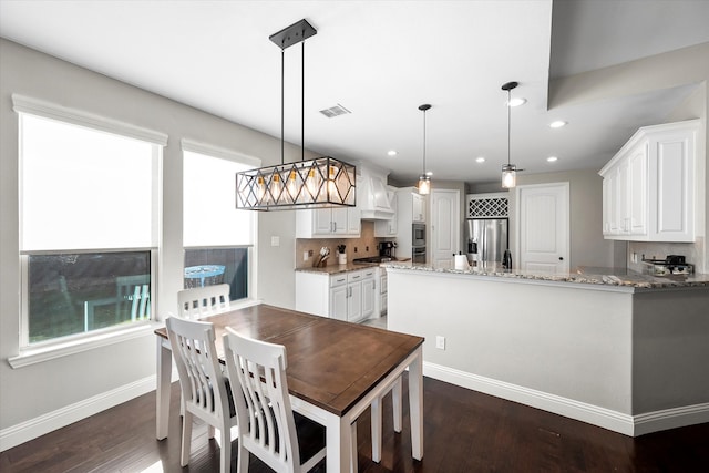 dining area with dark wood-type flooring