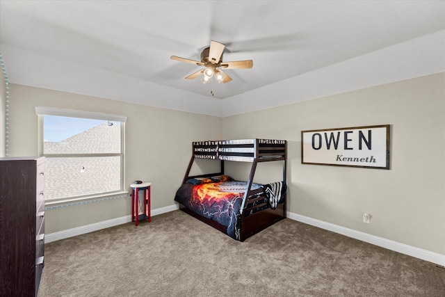 bedroom with lofted ceiling, ceiling fan, and carpet flooring