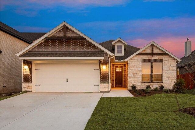 craftsman-style house with a yard and a garage