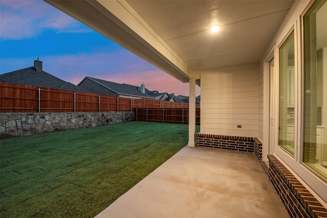 view of yard featuring a patio and a fenced backyard