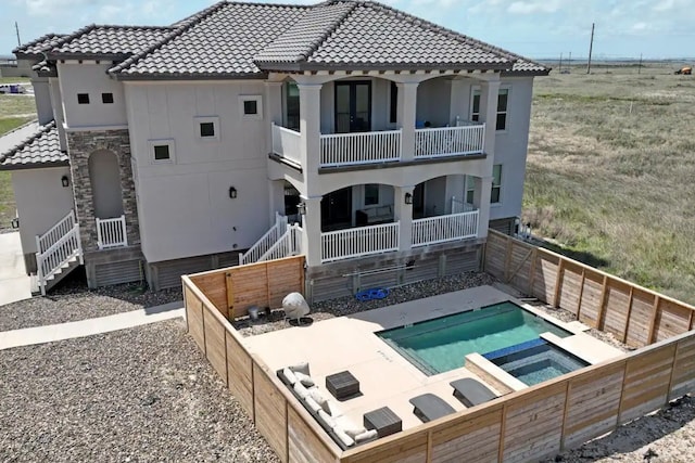 back of property with a patio area