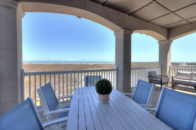 wooden deck featuring a water view