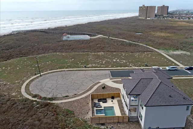 bird's eye view with a view of the beach and a water view