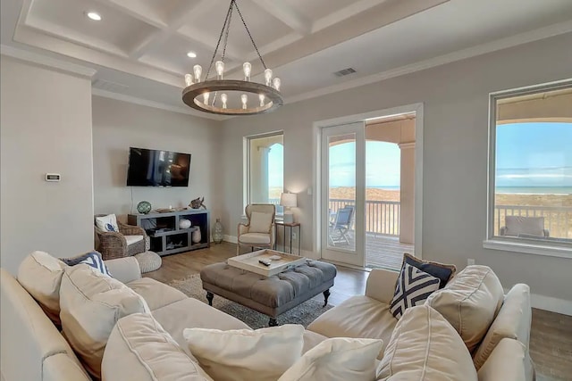 living room featuring wood-type flooring, coffered ceiling, and a notable chandelier