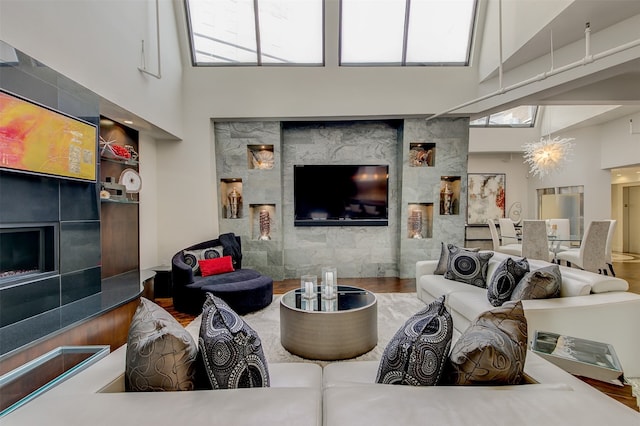 living room with hardwood / wood-style flooring and high vaulted ceiling