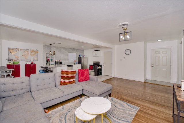 living room with light hardwood / wood-style floors