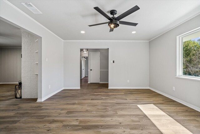 interior space with crown molding, ceiling fan, and dark wood-type flooring