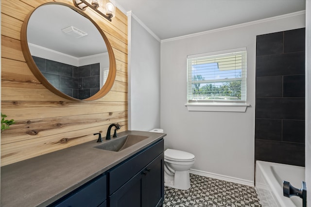 bathroom featuring tile patterned flooring, vanity, toilet, and crown molding