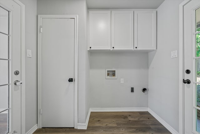 laundry room featuring electric dryer hookup, dark hardwood / wood-style flooring, cabinets, and washer hookup