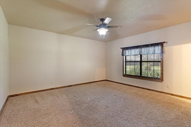 empty room featuring carpet floors, a textured ceiling, and ceiling fan