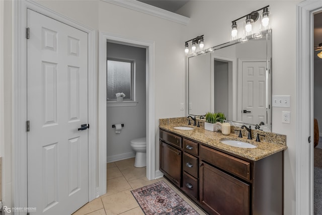 bathroom featuring crown molding, tile patterned flooring, vanity, and toilet