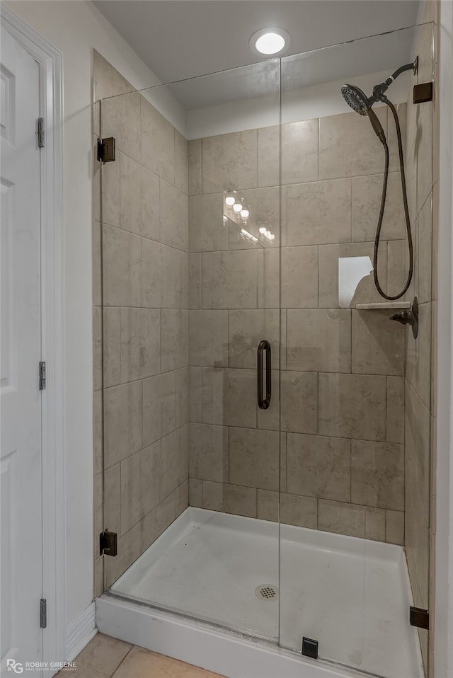 bathroom featuring tile patterned floors and walk in shower