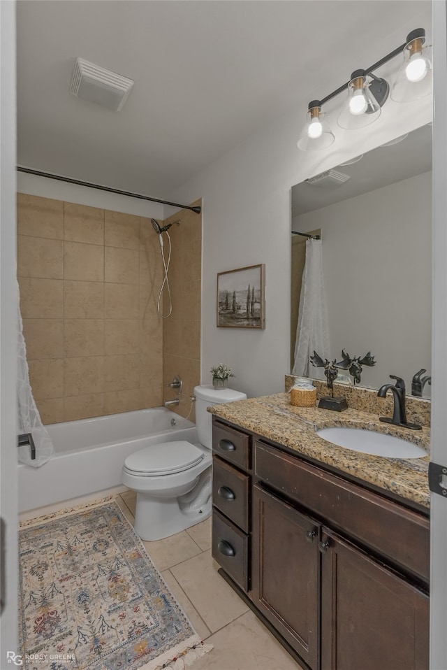 full bathroom with tile patterned floors, vanity, toilet, and shower / tub combo