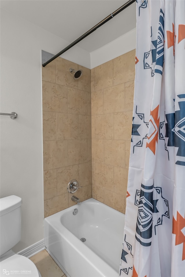 bathroom featuring shower / bathtub combination with curtain and toilet