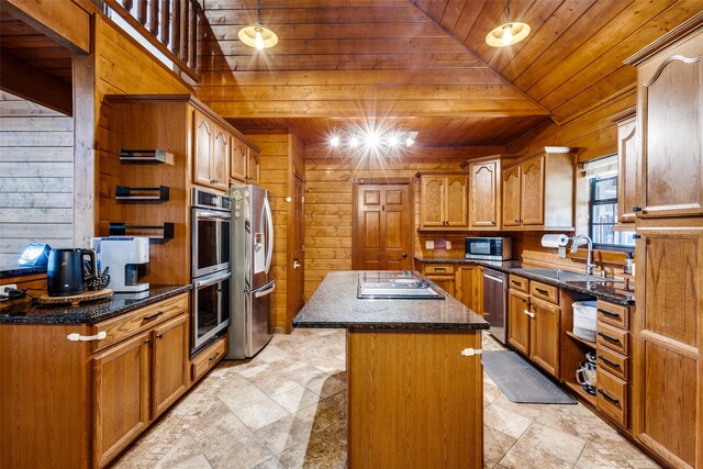 kitchen featuring dark stone countertops, sink, wood ceiling, and stainless steel appliances