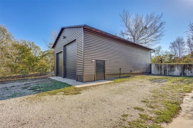 exterior space featuring an outbuilding and a garage