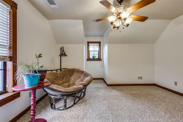 living room with vaulted ceiling, carpet flooring, and ceiling fan