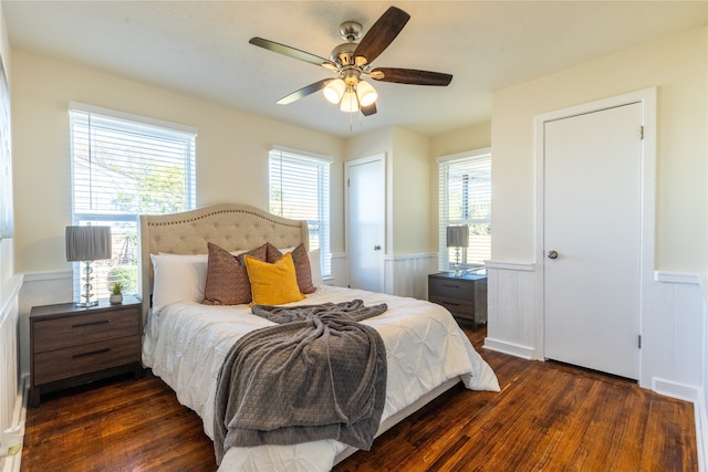 bedroom featuring ceiling fan and dark wood-type flooring