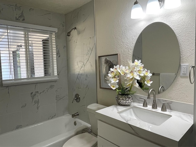 full bathroom with toilet, vanity, a textured ceiling, and tiled shower / bath