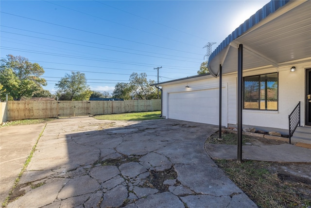 view of patio / terrace featuring a garage