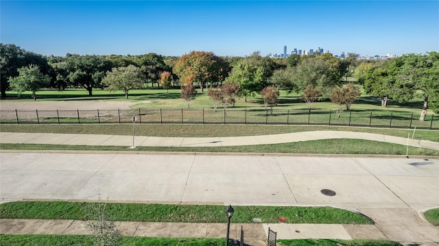 view of home's community with a yard