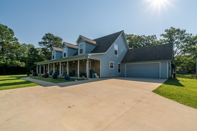 cape cod home featuring a front lawn, a porch, and a garage