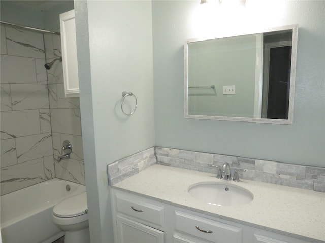 full bathroom featuring vanity, toilet, and tiled shower / bath