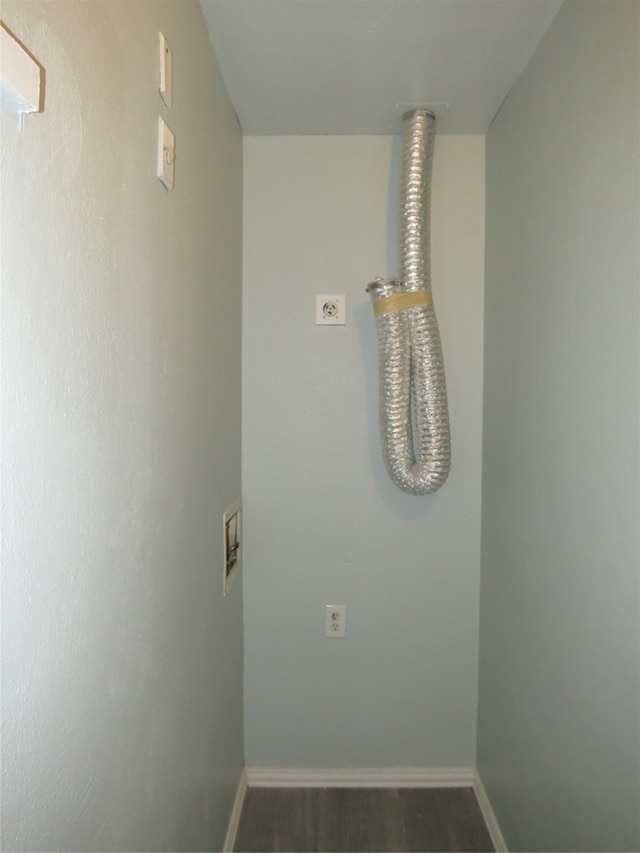 laundry room featuring electric dryer hookup, hookup for a washing machine, and dark hardwood / wood-style floors