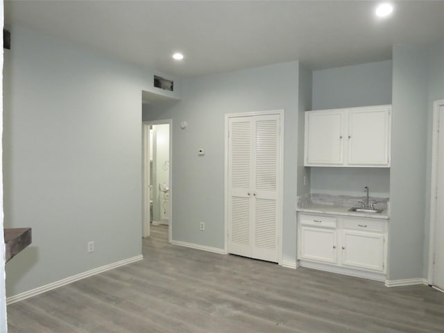 4715 N Galloway Ave Unit 104, Mesquite, TX 75150 - interior space with a sink, recessed lighting, wood finished floors, and baseboards