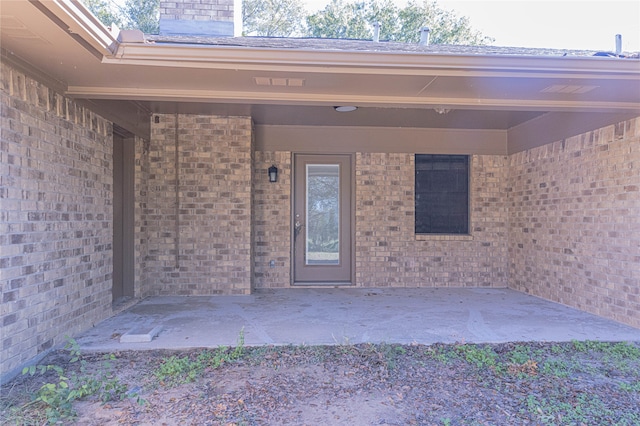 doorway to property featuring a patio area