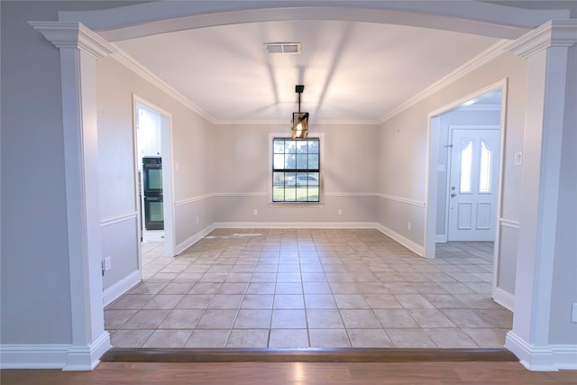 unfurnished dining area with light tile patterned floors and crown molding