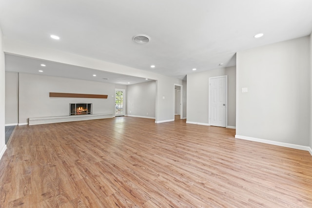 unfurnished living room featuring light wood-type flooring