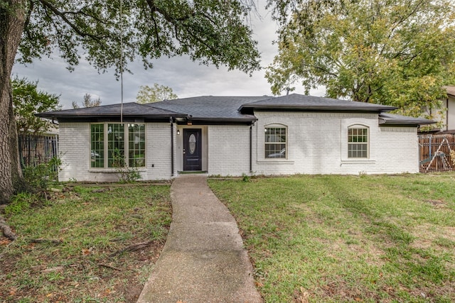 ranch-style house with a front yard