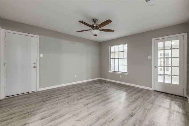 empty room featuring light hardwood / wood-style floors and ceiling fan