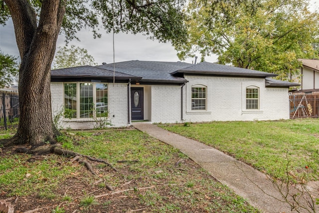 ranch-style house with a front yard