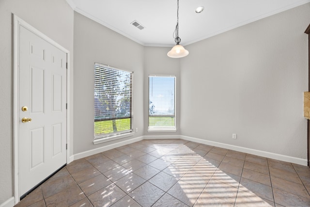 interior space with crown molding and tile patterned flooring