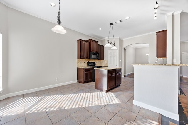 kitchen with tasteful backsplash, dark brown cabinets, pendant lighting, and ornamental molding