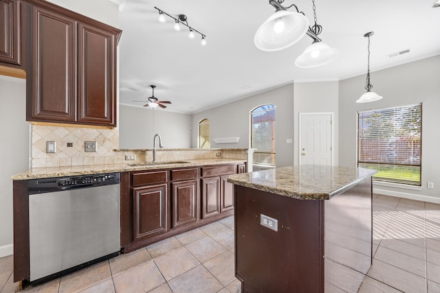 kitchen featuring tasteful backsplash, stainless steel dishwasher, dark brown cabinets, ceiling fan, and sink