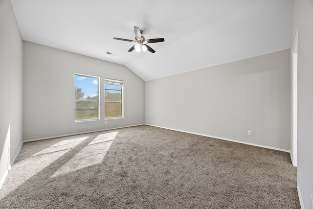 spare room with carpet, ceiling fan, and lofted ceiling