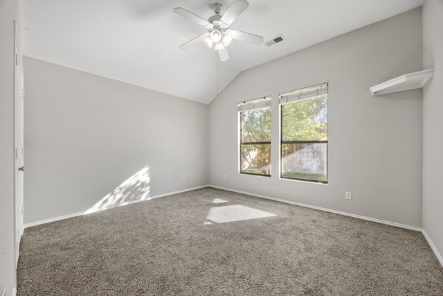 carpeted spare room with ceiling fan and lofted ceiling