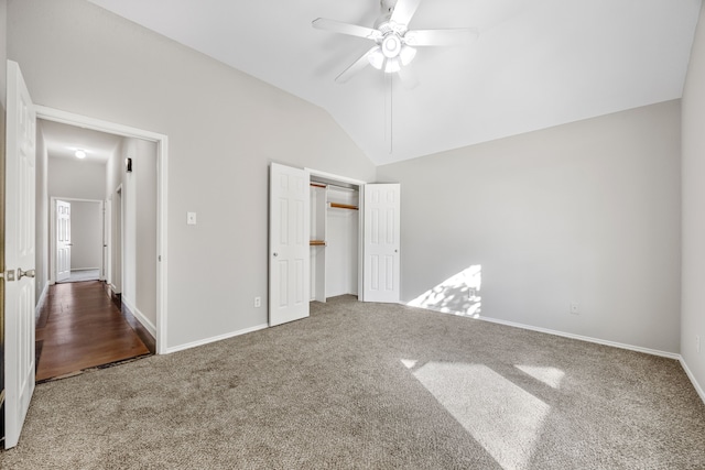 unfurnished bedroom with carpet flooring, a closet, ceiling fan, and lofted ceiling