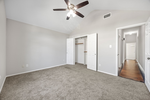 unfurnished bedroom featuring carpet flooring, ceiling fan, and a closet