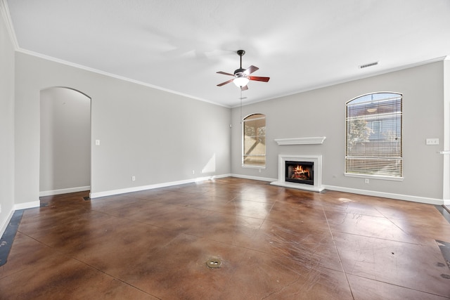 unfurnished living room featuring ceiling fan and ornamental molding